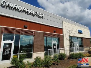 commercial building with different window films installed
