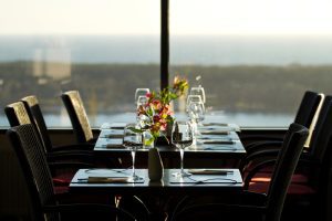 Modern restaurant interior with scenic seaside view