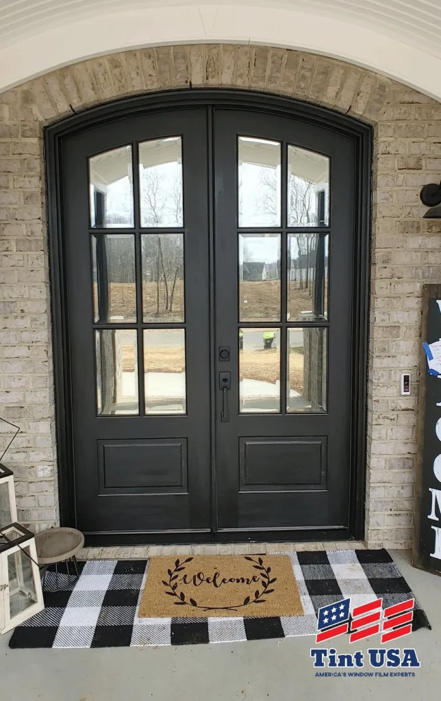 residential solar film on large brown front doors