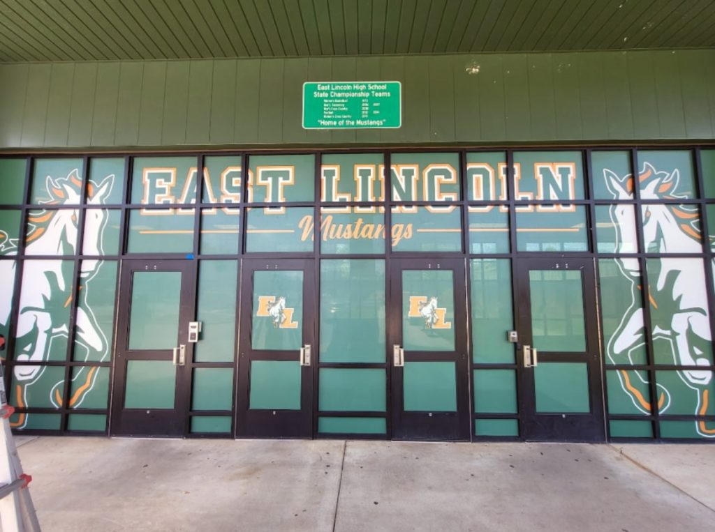 Vinyl graphic on high school windows and doors