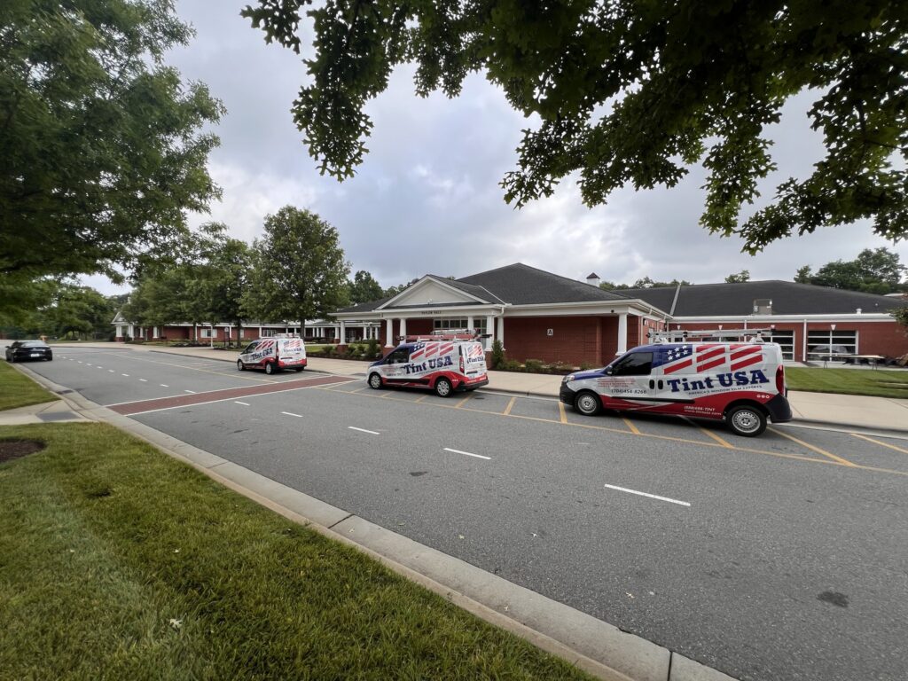 Tint USA vans on campus to install security window film on school windows